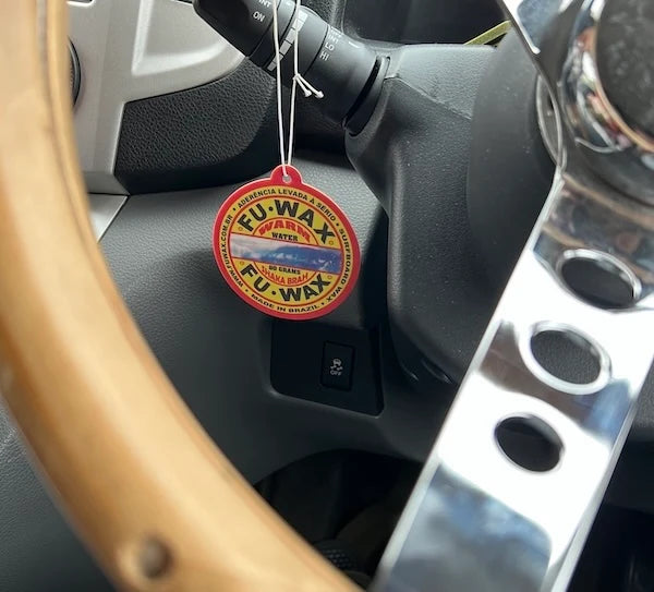 Fu Wax Air Freshener hanging by the steering wheel