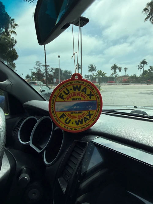 Fu Wax Air Freshener hanging on rearview mirror - palm trees